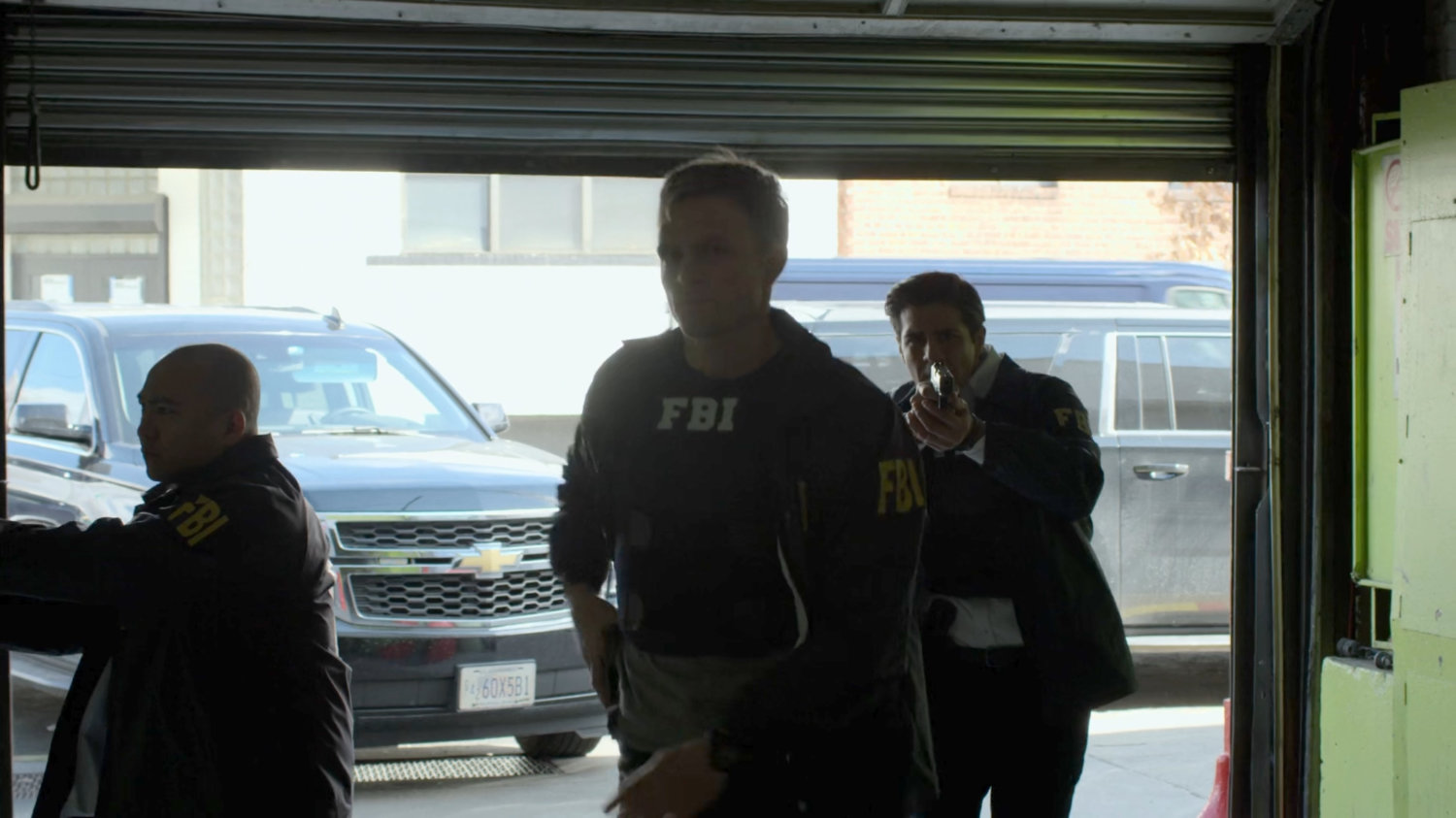 Agents Dex, Nadeem, and Arinori raid an auto garage.