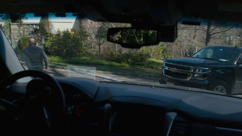 Two FBI SUVs follow Everett Starr towards his mansion.