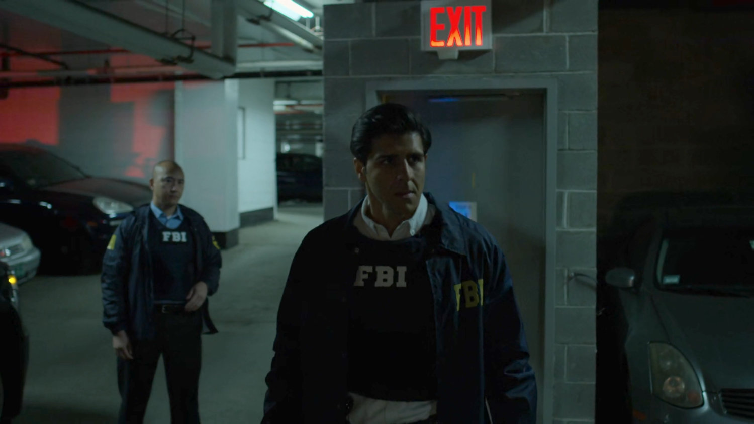 Agents Arinori and Nadeem in the Presidential Hotel parking garage.
