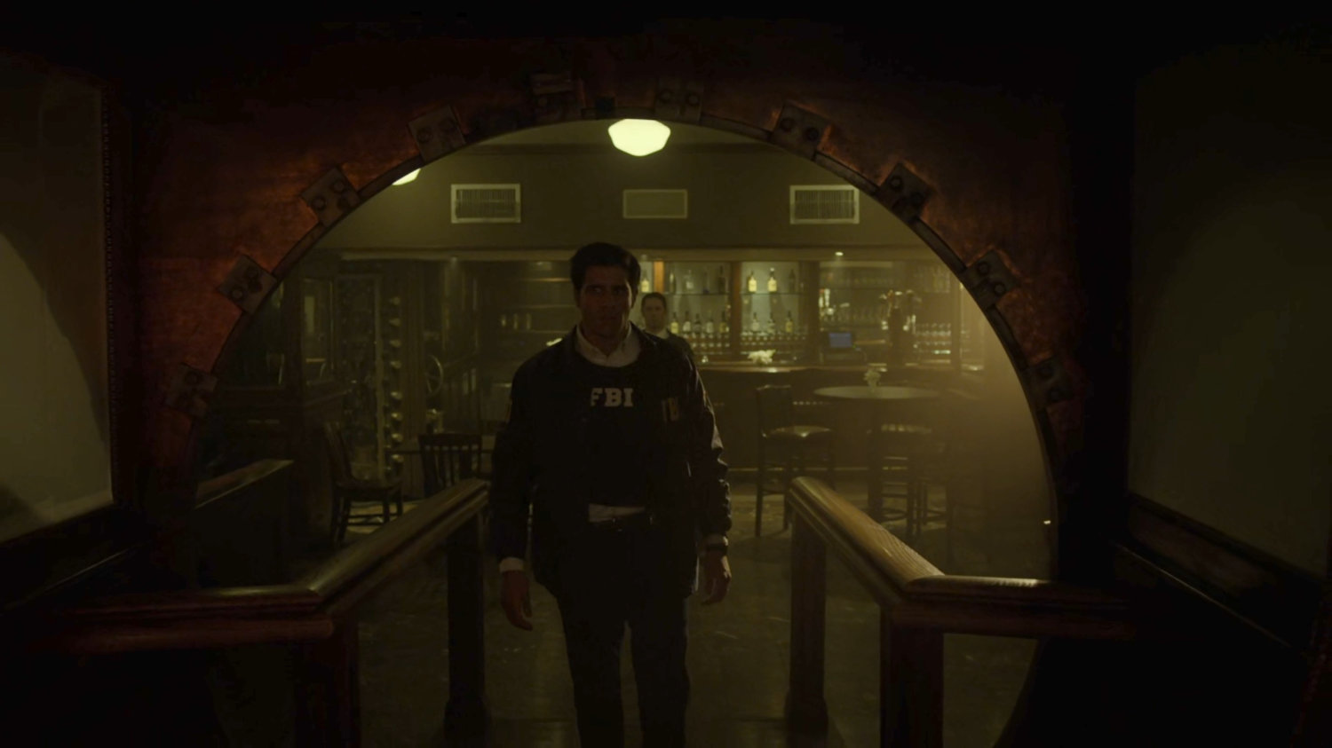 Agent Nadeem enters the Red Fish Blue Restaurant.
