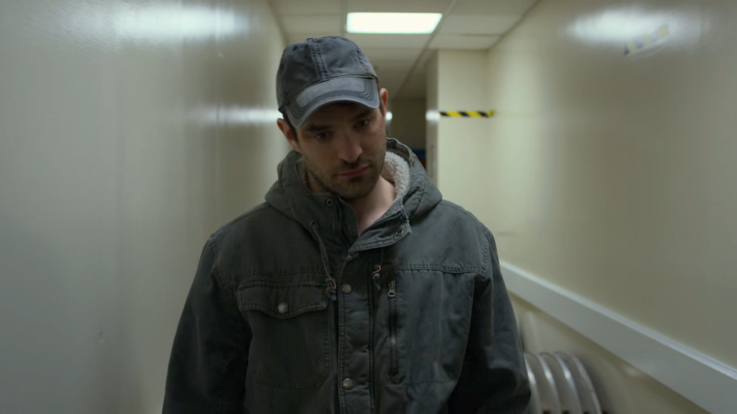 Matt walking through a hallway at the Presidential Hotel.