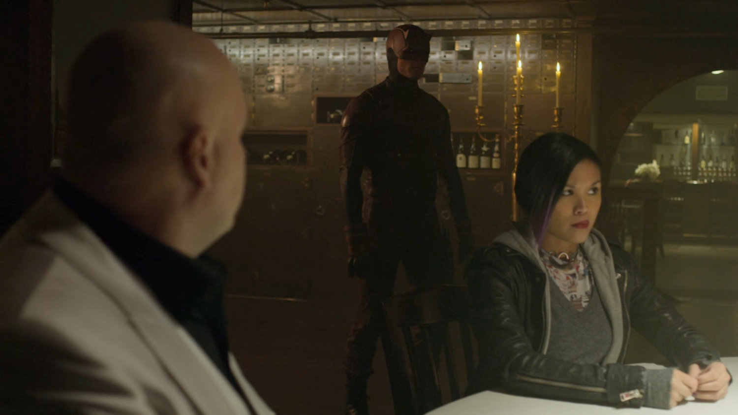Fisk, Dex as Daredevil, and Sophia Carter in the Red Fish Blue Restaurant.