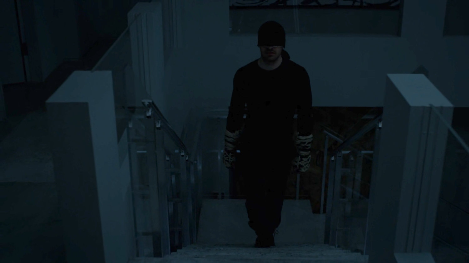 Matt walking up the stairs in the penthouse of the presidential Hotel.