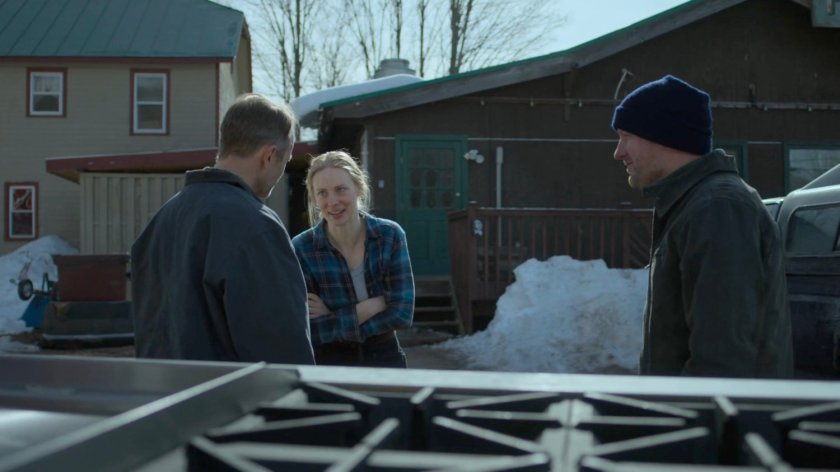 Karen and her father Paxton talk with a delivery driver Jake outside Penny's Place.