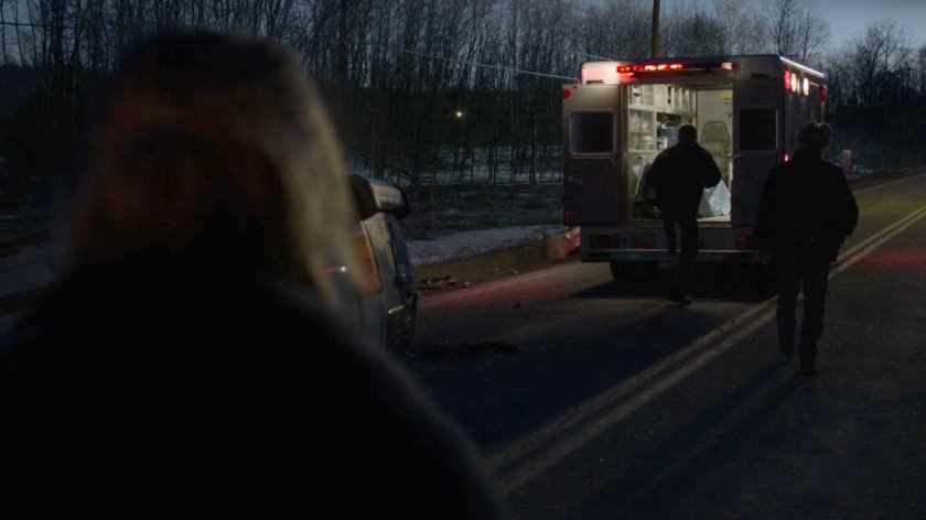 Paxton gets into an ambulance by the car accident on a Vermont road.