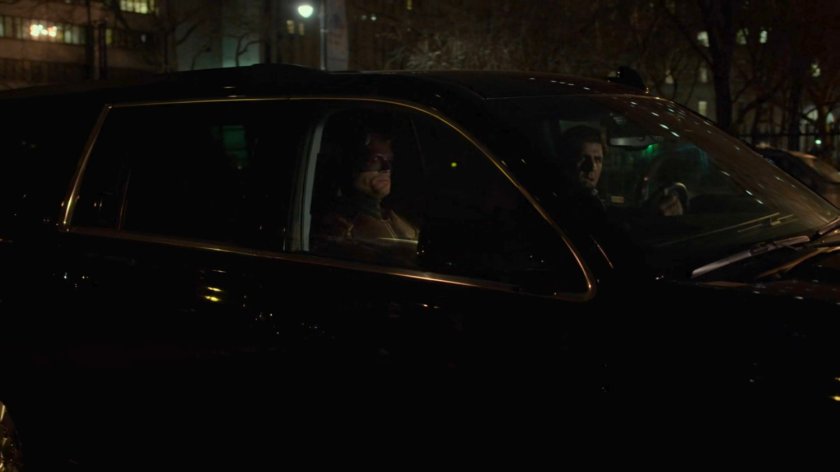 Dex, as Daredevil, and Nadeem in and FBI SUV on street outside Clinton Church.