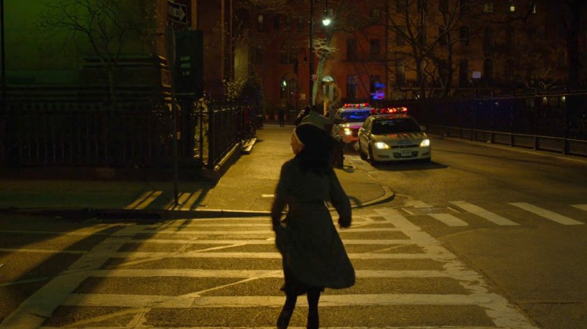 Maggie running across a crosswalk outside Clinton Church.