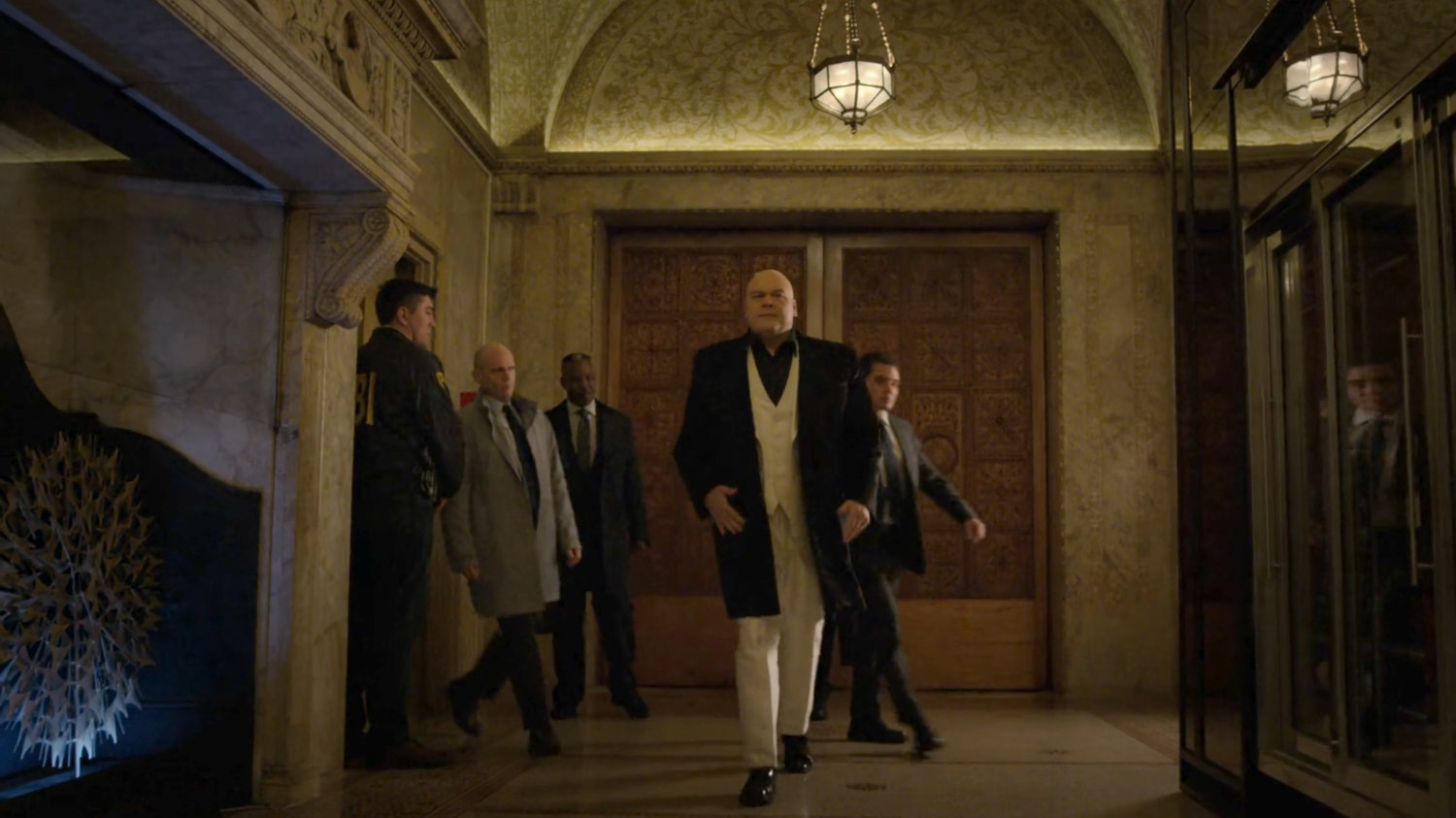 Fisk with his lawyers and an FBI agent outside the elevator in the lobby of the Presidential Hotel.