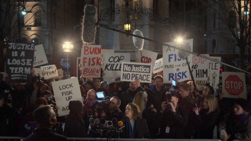 Protestors with anti-Fisk signs outside the Presidential Hotel.