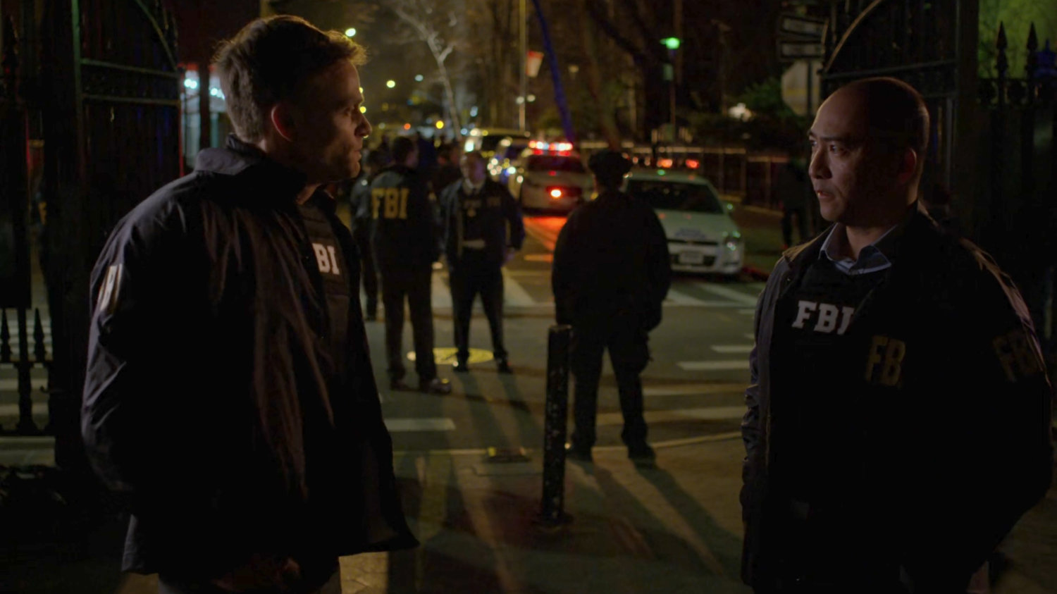 Agents Dex and Arinori on the sidewalk outside Clinton Church.