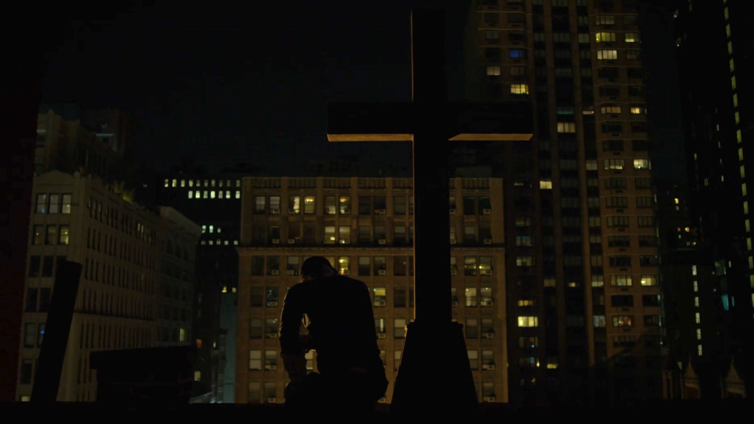 Matt on the rooftop of Clinton Church by the crucifix.