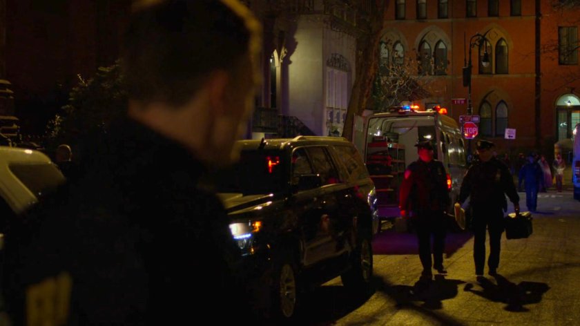 Dex watches officers leaving a van outside Clinton Church.