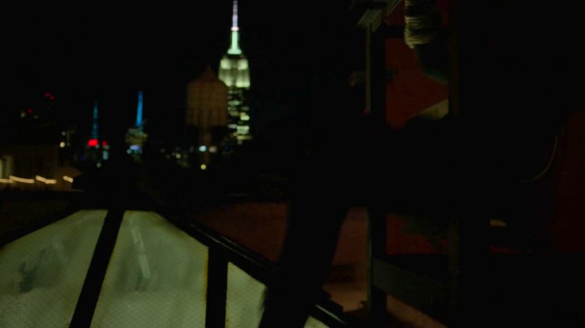 Matt running across a rooftop.