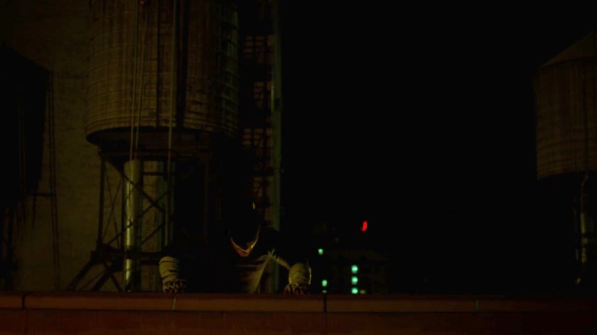 Matt vaulting over a ledge on a rooftop.