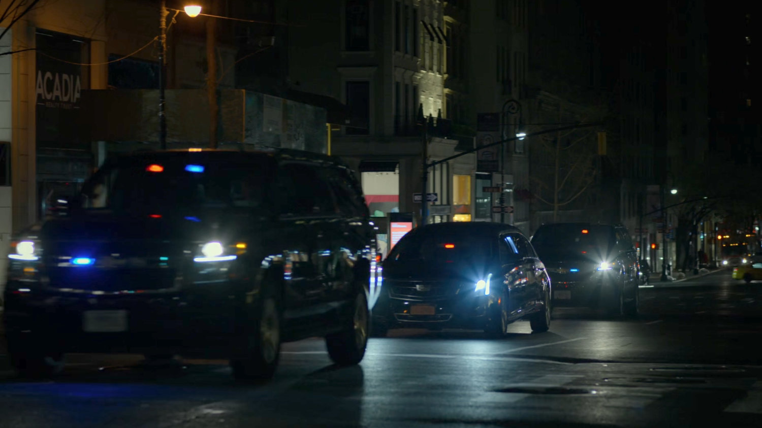 A convoy of Fisk vehicles on a New York Avenue.