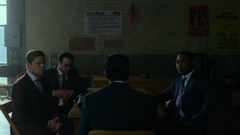 Ray gives testimony to DA Tower with Matt and Foggy in Fogwell's Gym.