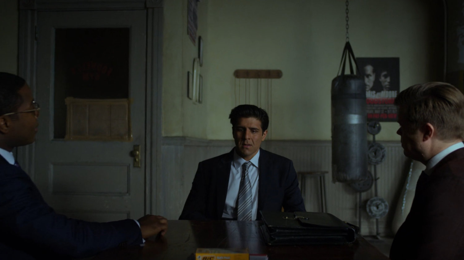 Ray gives testimony to DA Tower with Matt and Foggy in Fogwell's Gym.