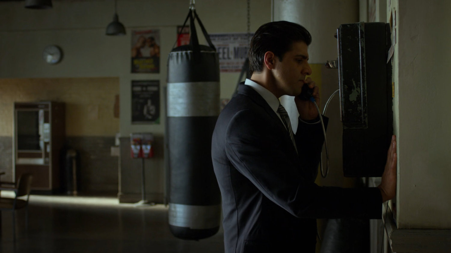 Ray on phone inside Fogwell's Gym.