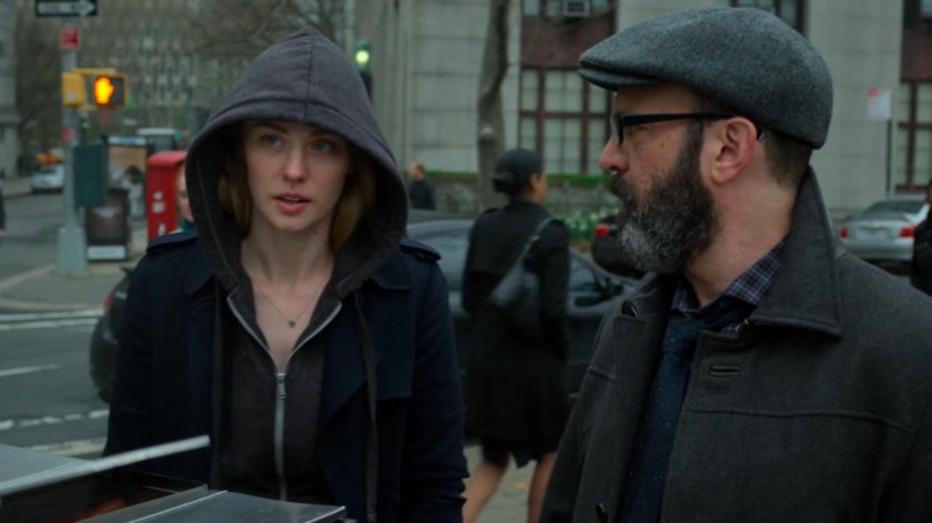 Karen and Ellison on street corner by hot dog cart.