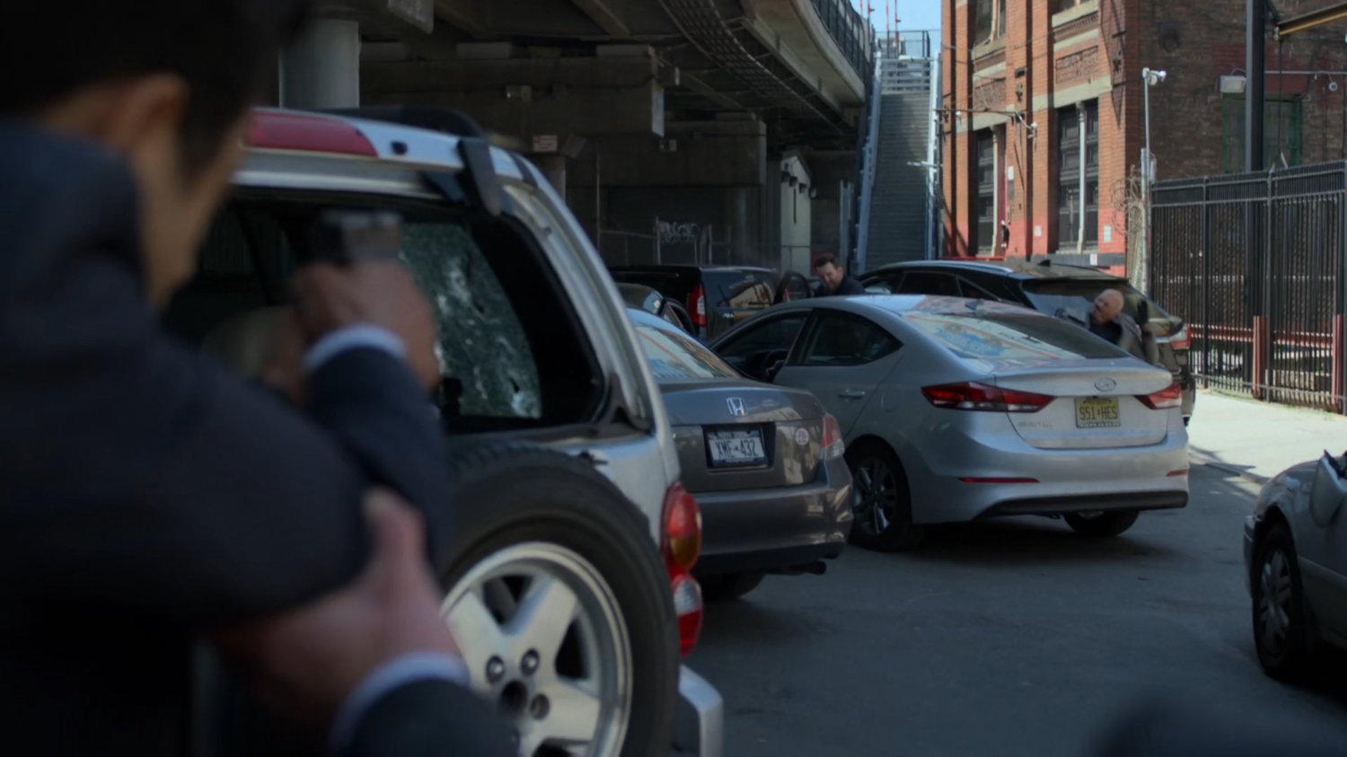 Nadeem shooting at gunmen in traffic jam.