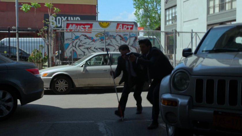 Matt and Nadeem sneak around stopped cars.