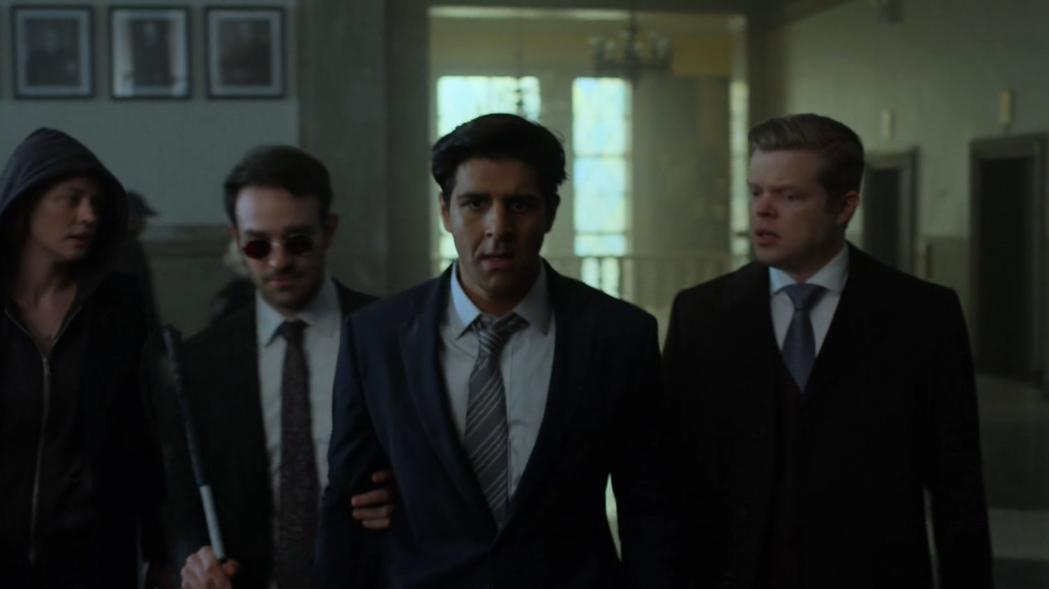 Matt, Nadeem, and Foggy walking through a courthouse.