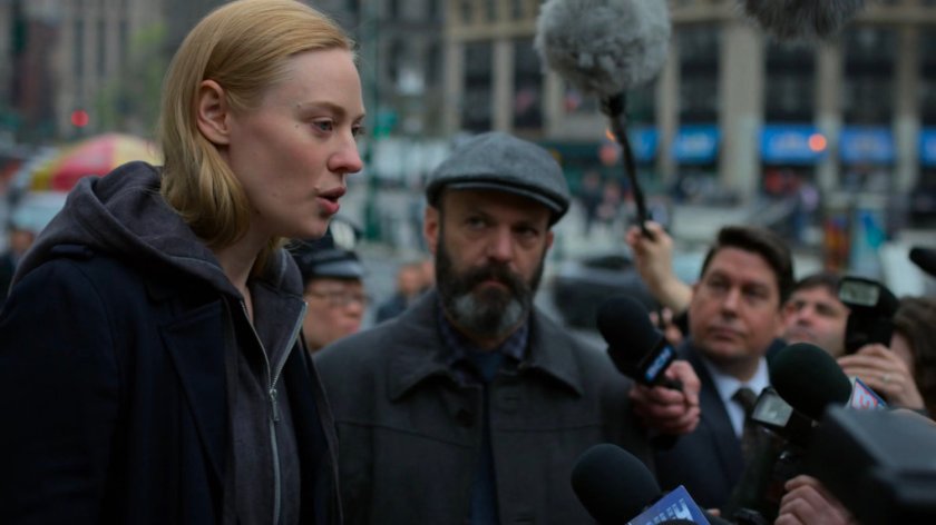 Karen and Ellison stand before reporters on steps outside courthouse.