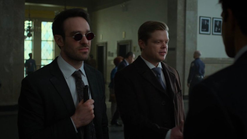 Matt and Foggy in hallway outside courtroom.