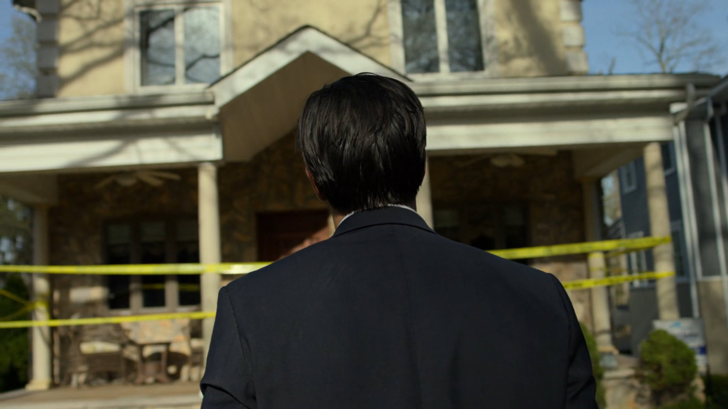 Ray walking towards his house.