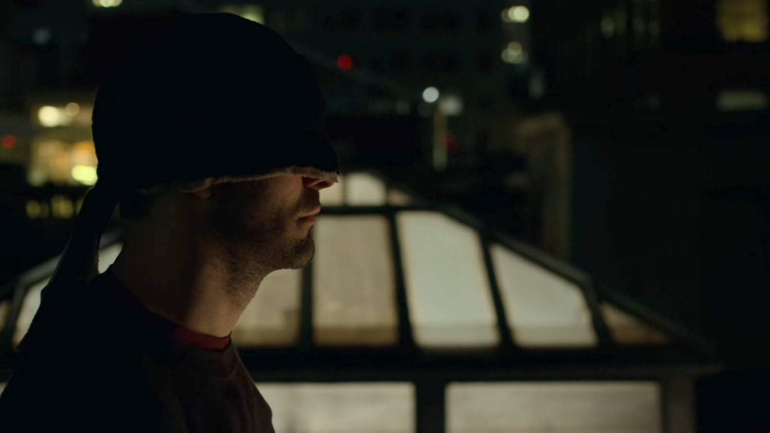 Matt on a dark rooftop.