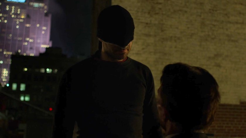 Matt interrogating Felix Manning on a dark rooftop.