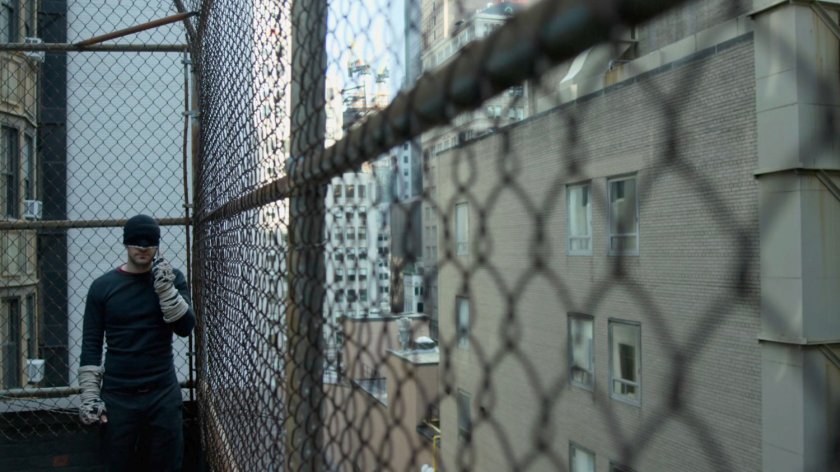 Matt making phone call on rooftop.