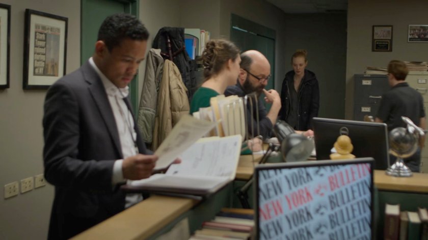 Karen enters the New York Bulletin bullpen.