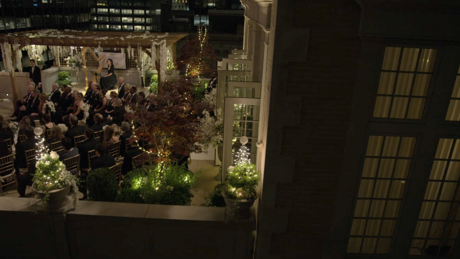 A nighttime wedding ceremony on the Presidential Hotel roof.