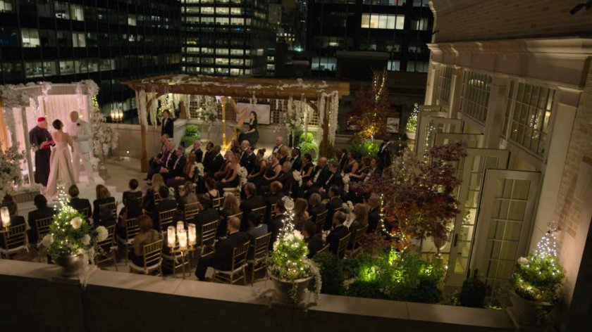 A nighttime wedding ceremony on the Presidential Hotel roof.