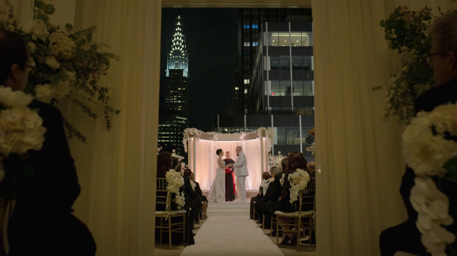 A nighttime wedding ceremony on the Presidential Hotel roof.