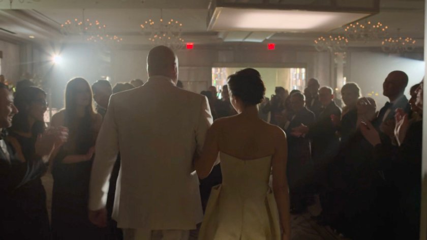 Mr. and Mrs. Fisk enter the wedding reception in the Presidential Hotel ballroom.