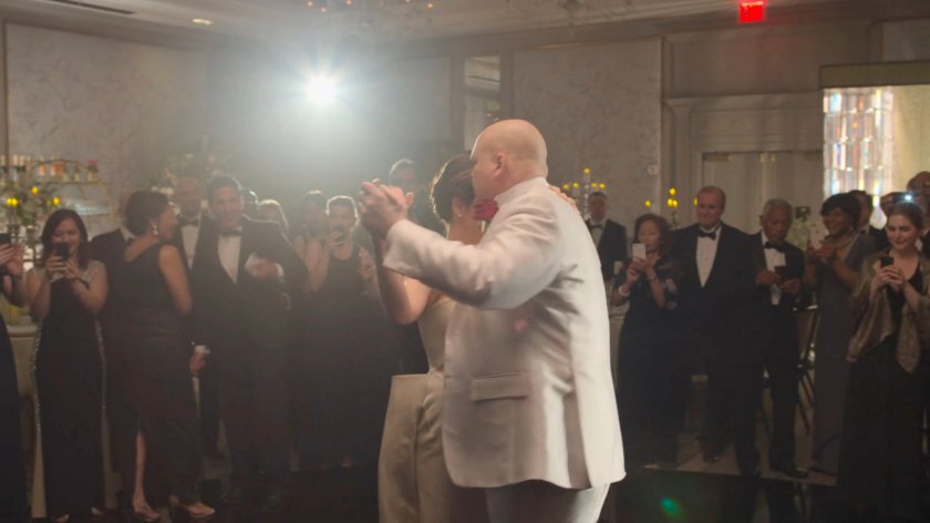 Fisk and Vanessa dance at the wedding reception in the Presidential Hotel ballroom.