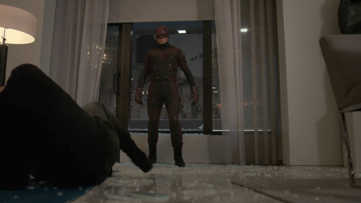 Dex, dressed as Daredevil, in the penthouse of the Presidential Hotel.