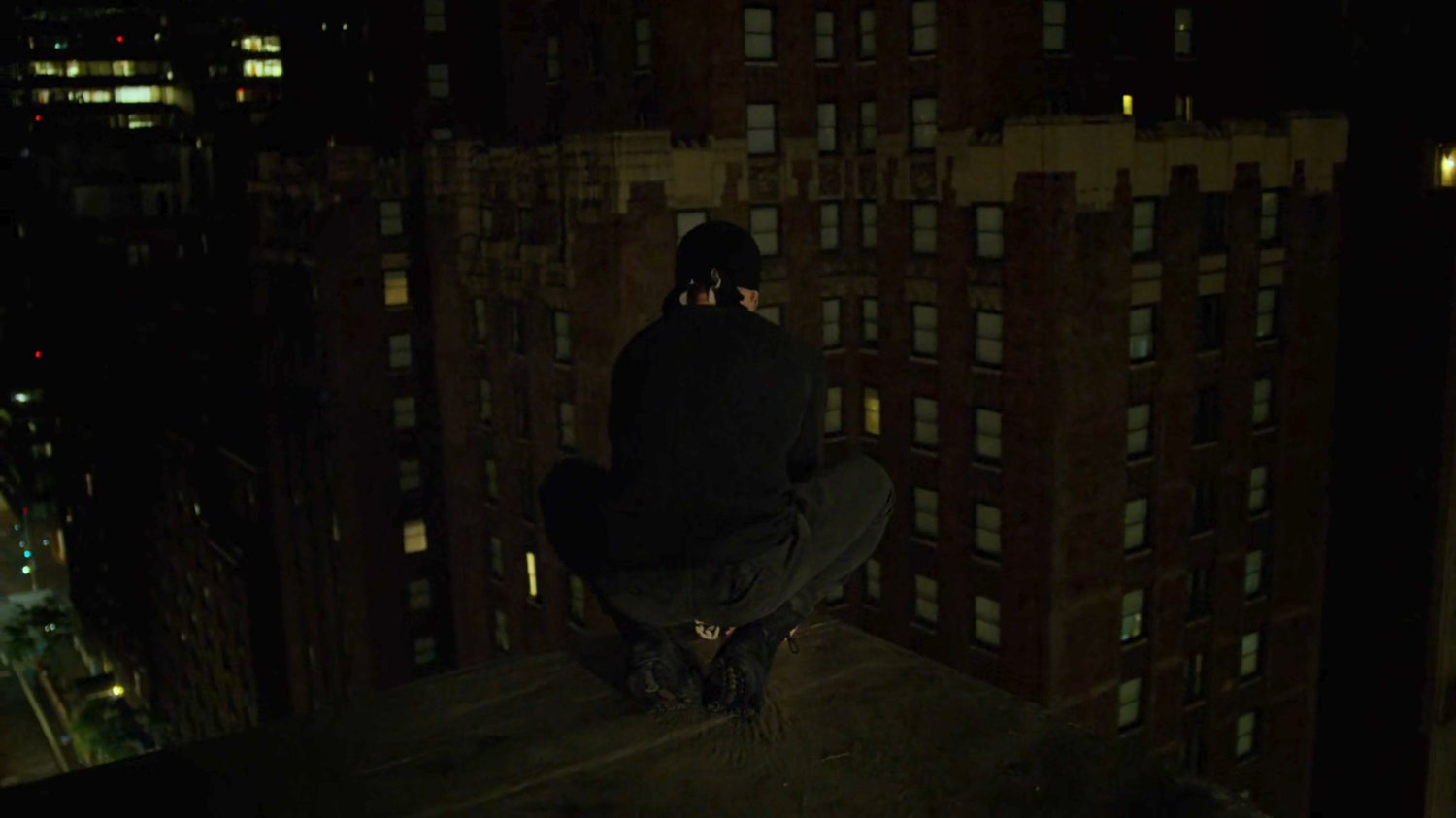 Matt perched on a rooftop ledge above the Presidential Hotel.