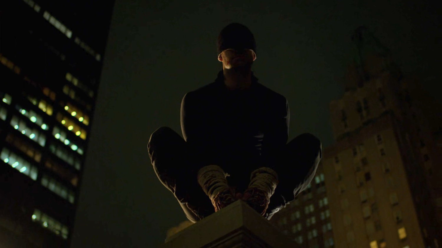 Matt perched on a rooftop ledge above the Presidential Hotel.