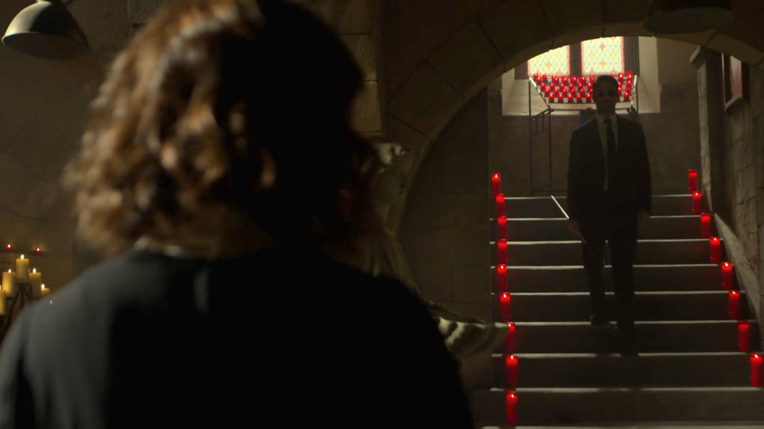 Matt entering the basement under Clinton Church, walking towards Maggie.