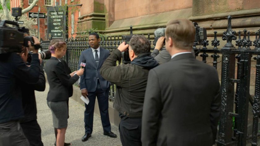 DA Tower giving an interview on the sidewalk outside Clinton Church.