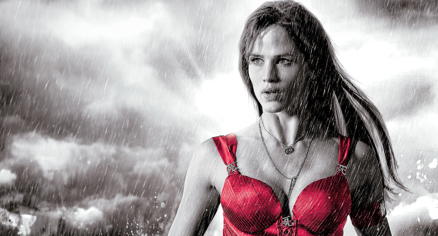 Elektra in her red outfit standing in the rain.
