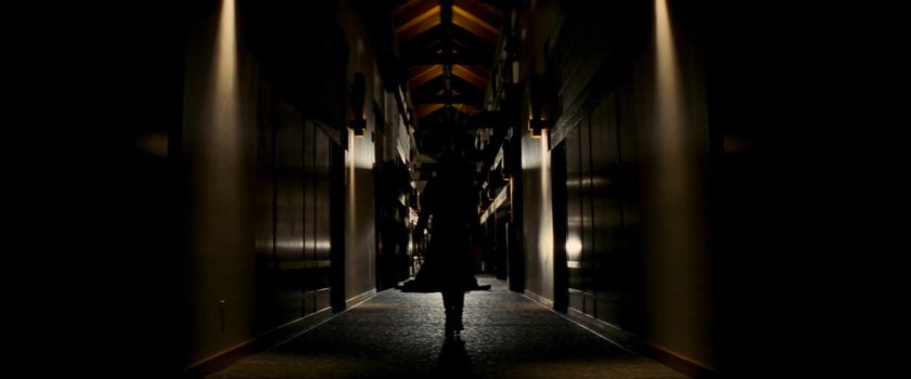 Shadowy figure walking along hallway in Demarco's residence.