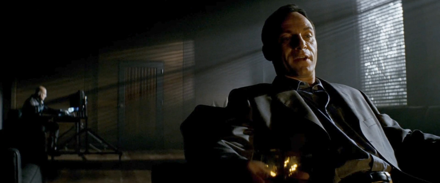 DeMarco and his body guard in a dark room.