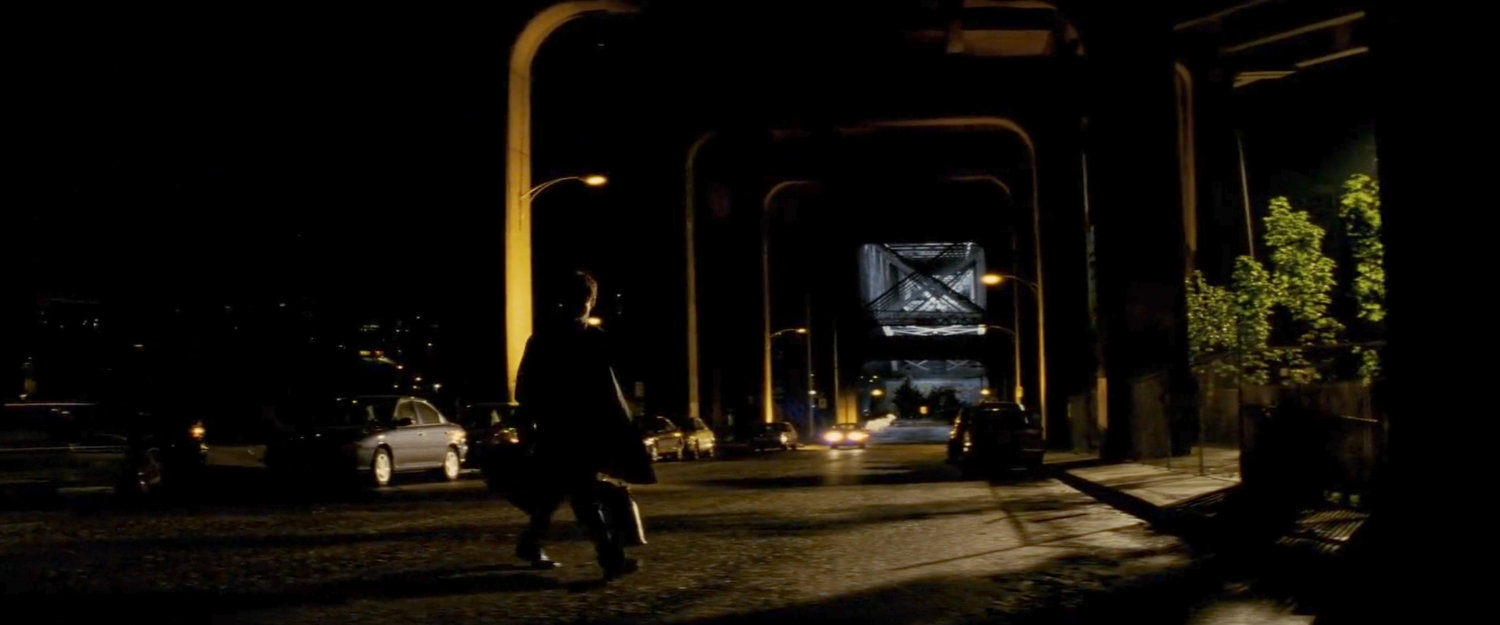McCabe crossing street outside Elektra's residence.