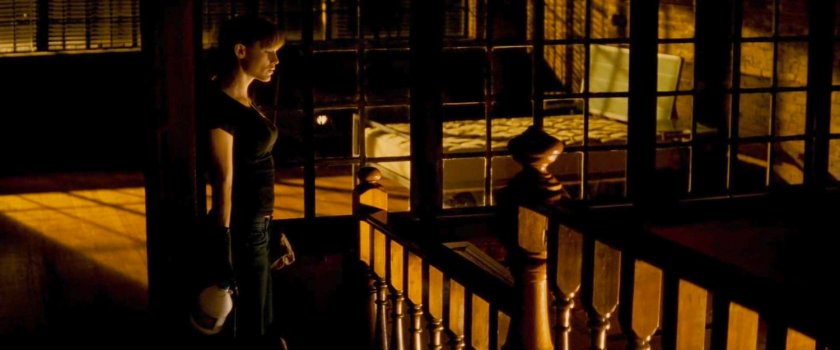 Elektra by the stairs in her residence.