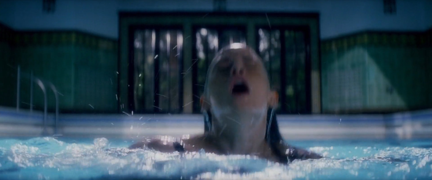 Young Elektra in the pool at her mansion.