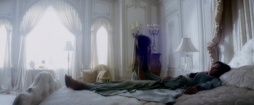 Young Elektra in her mother's room in the Natchios mansion.